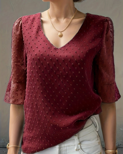 Losse blouse met lage mouwen