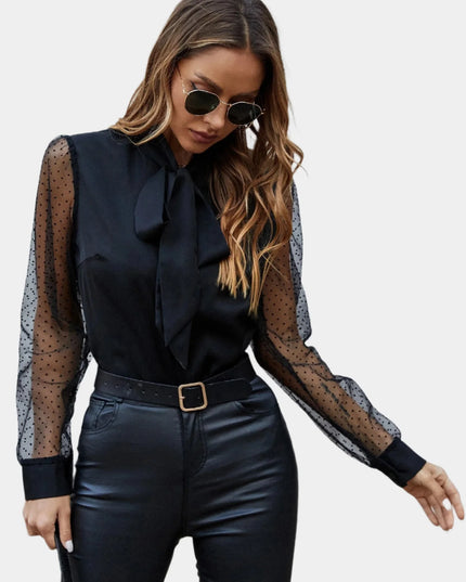Mouwloos shirt met mesh en knopen