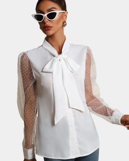 Mouwloos shirt met mesh en knopen