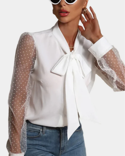 Mouwloos shirt met mesh en knopen