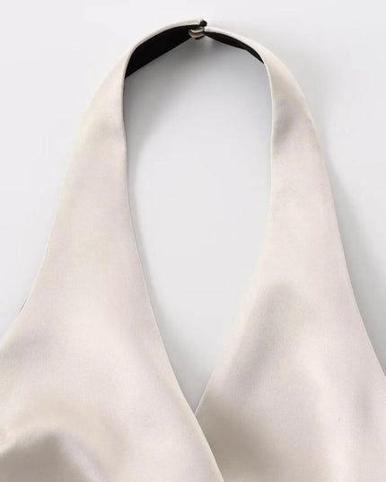 Champagnekleurige top met strikceintuur