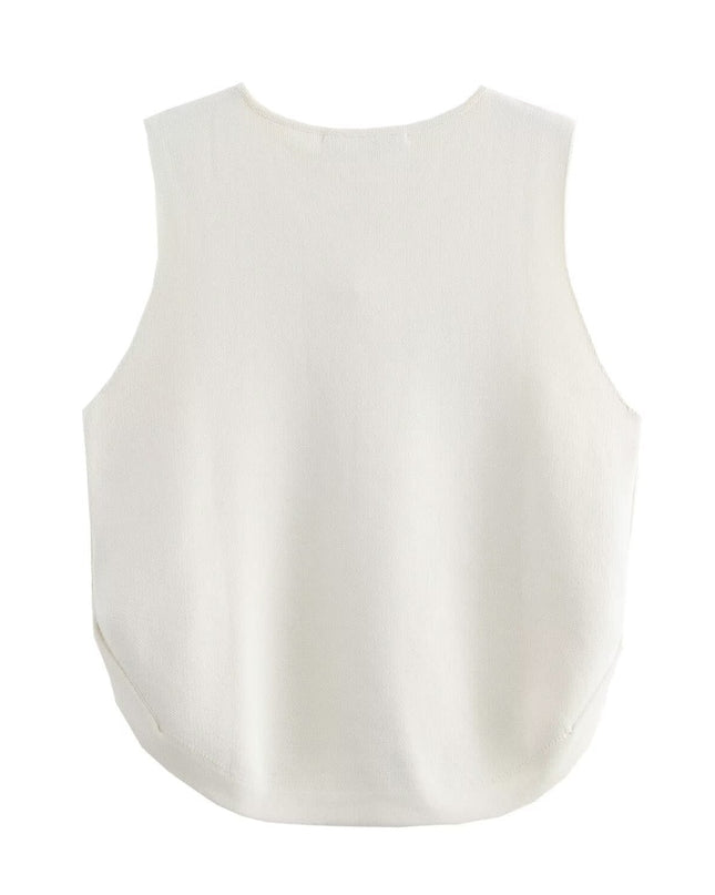 Gebreid vest met knoopversiering aan de zijkant