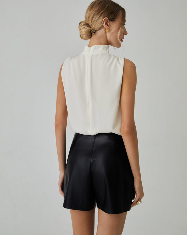 Mouwloze blouse met hoge halslijn