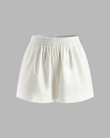 Set van halternektop en backless shorts