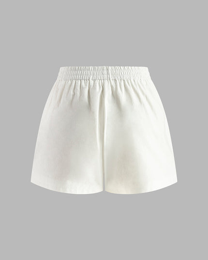 Set van halternektop en backless shorts