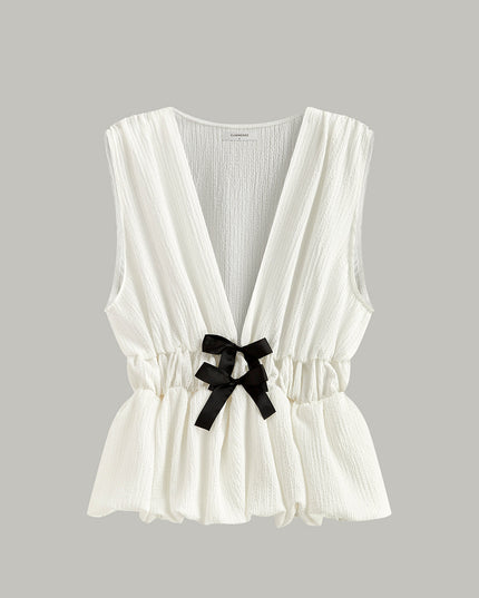 Top met strikdetail in V-hals