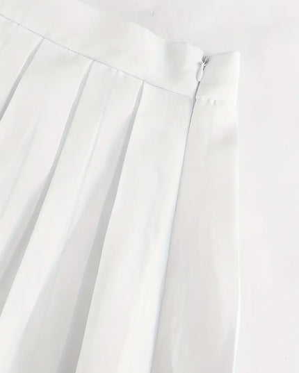 Elegant pak met geplooide minirok