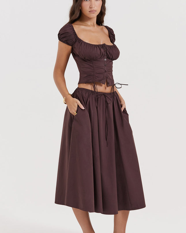 Diepbruine geplooide top en geplooide midi-rok