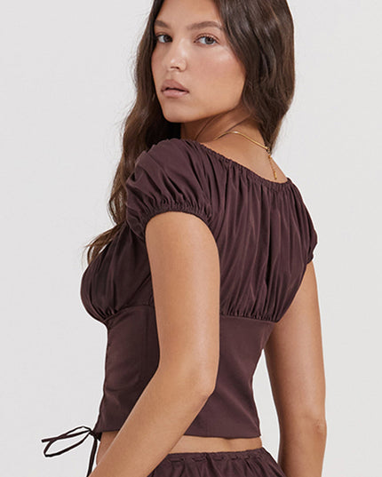 Diepbruine geplooide top en geplooide midi-rok