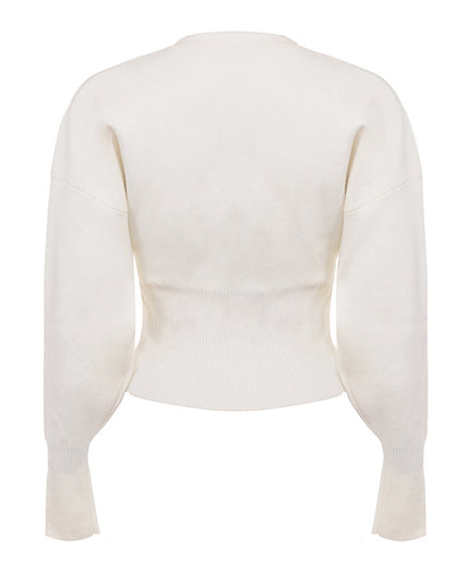 Wit gebreid vest met V-hals en broek