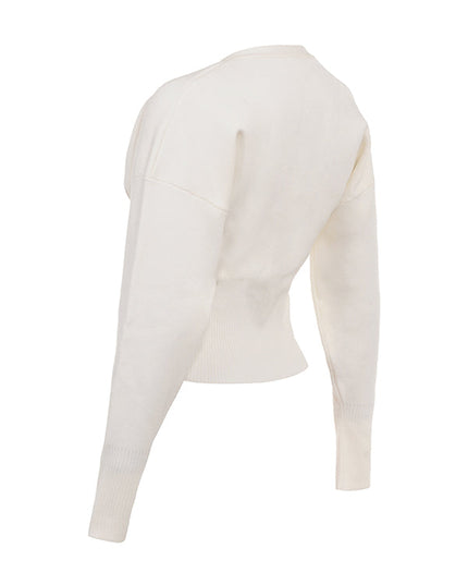 Wit gebreid vest met V-hals en broek