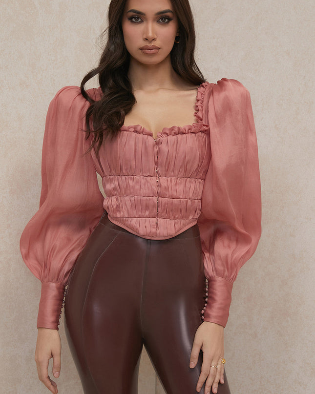 Rouge korset met lange mouwen en ruches