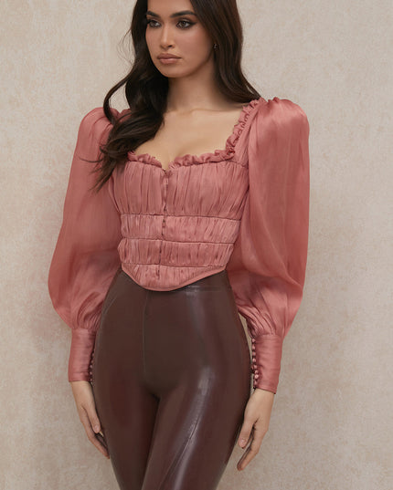 Rouge korset met lange mouwen en ruches